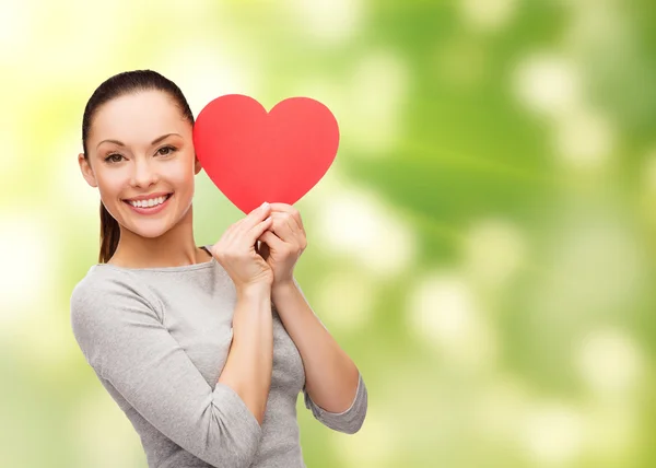 Smiling asian woman with red heart — Stock Photo, Image