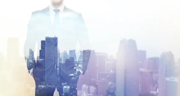 Close up of businessman over city background — Stock Photo, Image