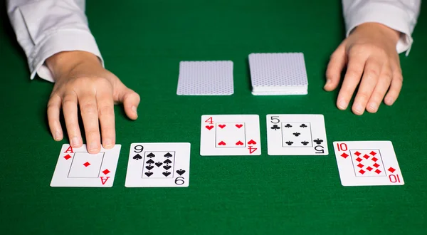 Holdem dealer with playing cards — Stock Photo, Image