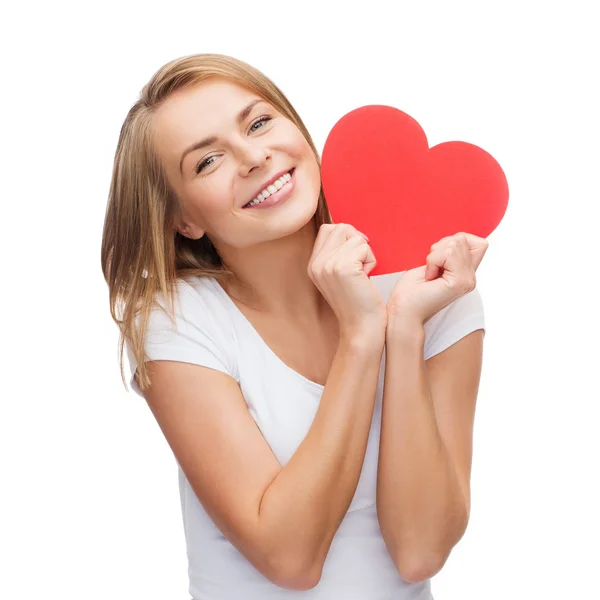 Smiling woman in white t-shirt with heart — Stock Photo, Image