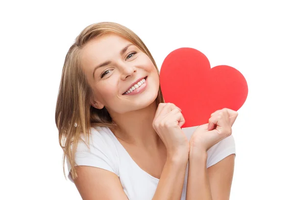 Femme souriante en t-shirt blanc avec coeur Photos De Stock Libres De Droits