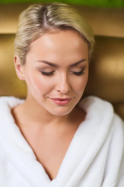 Close up of woman sitting in bath robe at spa — Stock Photo, Image