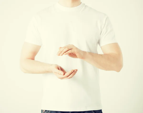 Mans hands showing something — Stock Photo, Image