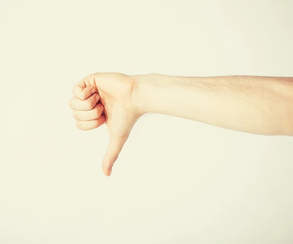 Man showing thumbs down — Stock Photo, Image