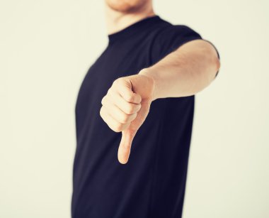 man showing thumbs down clipart
