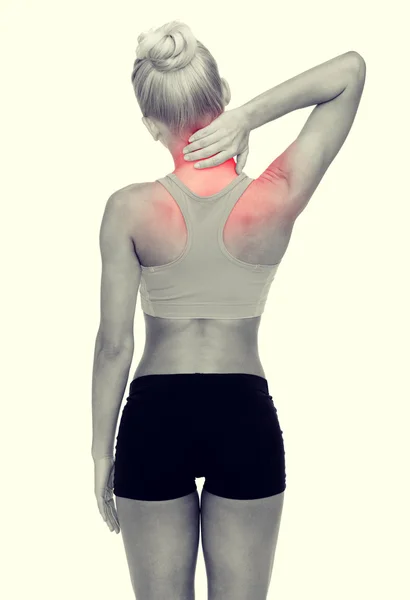 Sporty woman touching her neck — Stock Photo, Image