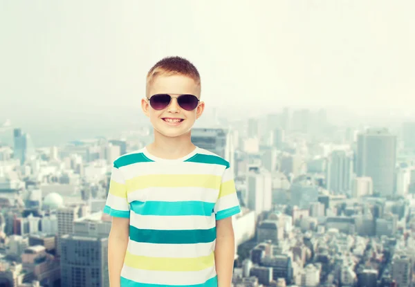 Smiling little boy over green background — Stock Photo, Image