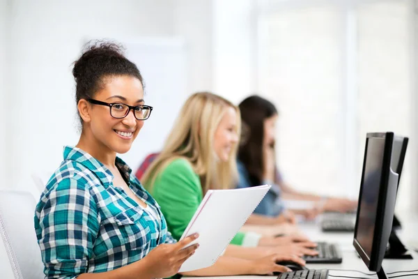 African student with computer studying at school — Stock Photo, Image