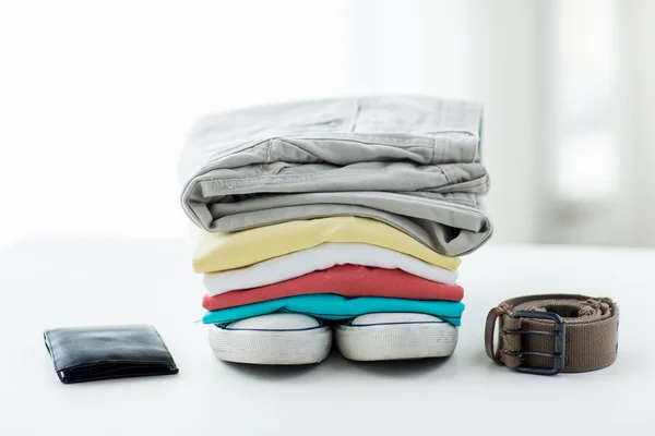 Close up of clothes and accessories on table — Stock Photo, Image