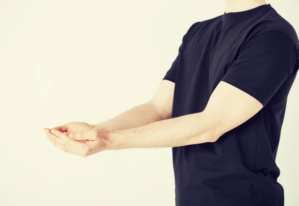 Mans hands showing something — Stock Photo, Image