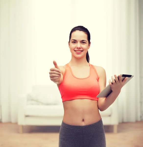 Sportieve vrouw met tablet pc-computer — Stockfoto