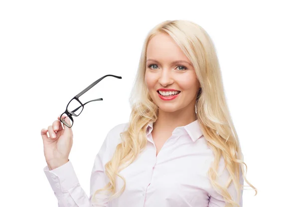 Smiling businesswoman or secretary in office — Stock Photo, Image