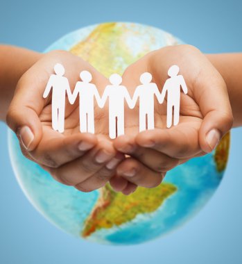 close up of human hands with earth globe clipart