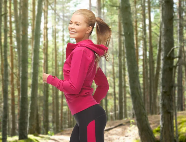 Happy woman running or jogging — Stock Photo, Image