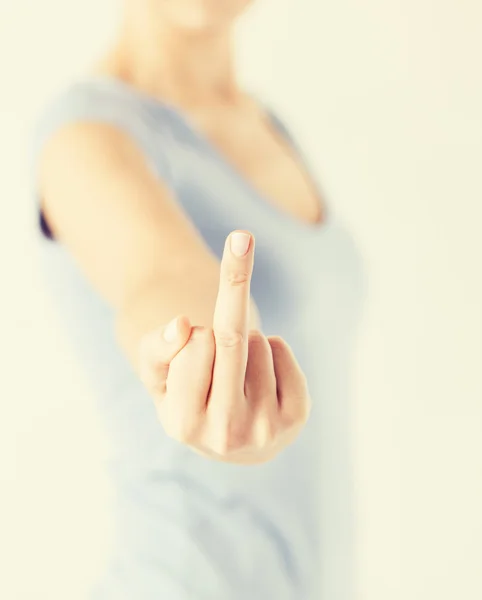 Woman showing middle finger — Stock Photo, Image