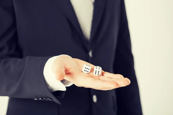 Mans hand holding white casino dice — Stock Photo, Image
