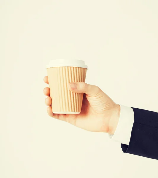 Man hand holding take away coffee — Stock Photo, Image