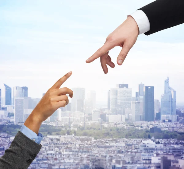 Close up of woman and man hands trying to connect — Stock Photo, Image