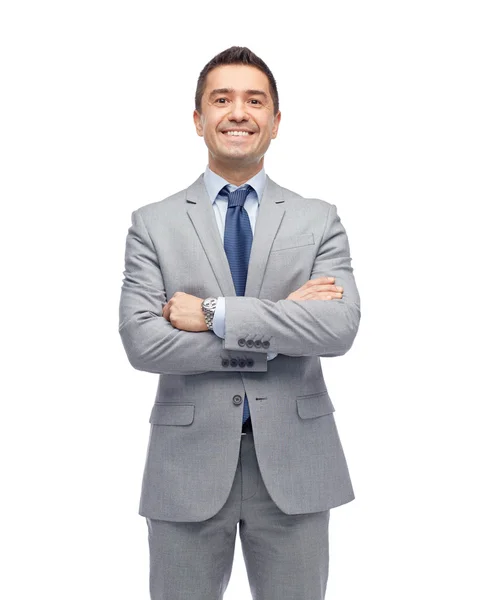 Счастливый улыбающийся бизнесмен в костюме — стоковое фото