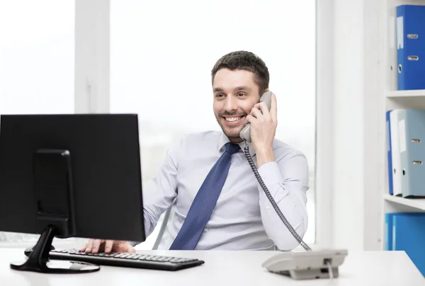 Smiling businessman or student with computer — Stock Photo, Image