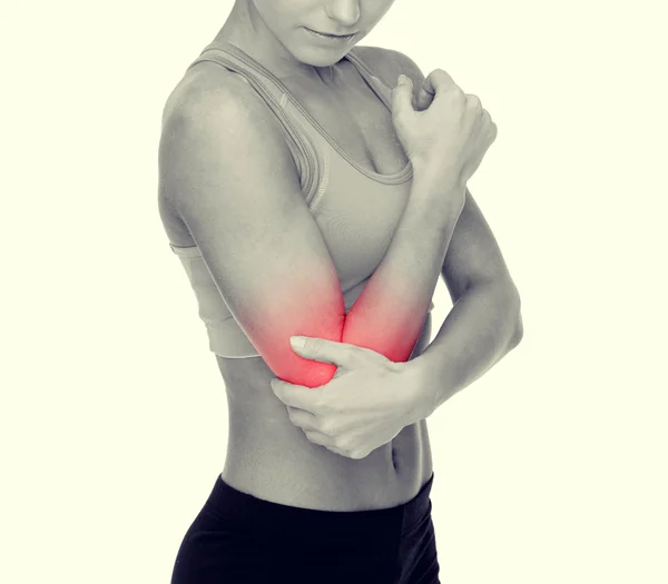 Donna sportiva con dolore al gomito — Foto Stock