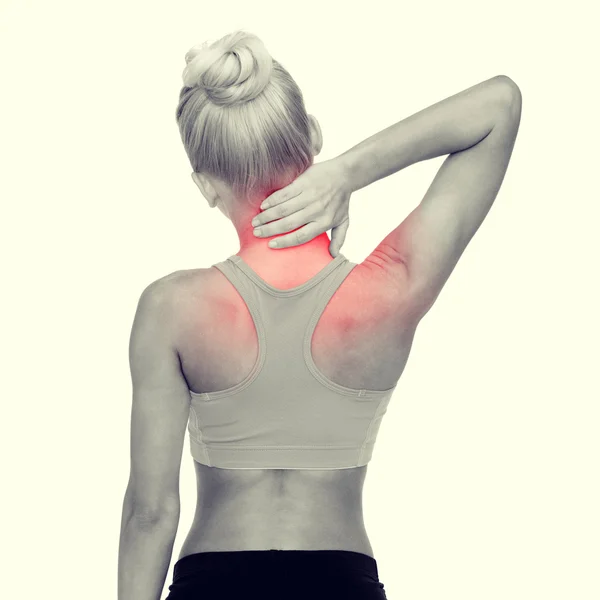 Sporty woman touching her neck — Stock Photo, Image