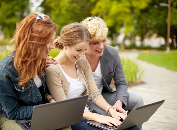 Students or teenagers with laptop computers — Stock Photo, Image