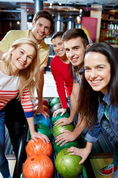 Happy friends in bowling club — Stock Photo, Image