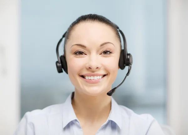 Kobieta operator infolinii ze słuchawkami — Zdjęcie stockowe