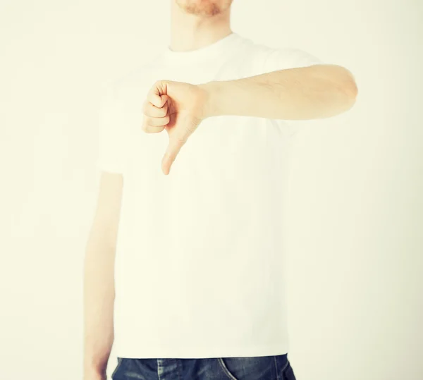 Man showing thumbs down — Stock Photo, Image