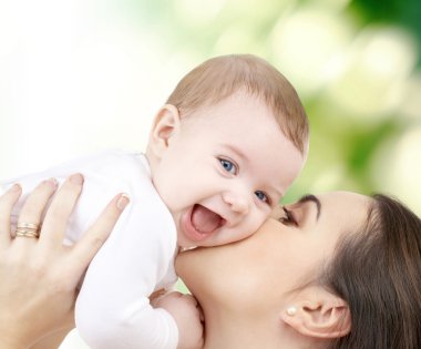 laughing baby playing with mother clipart