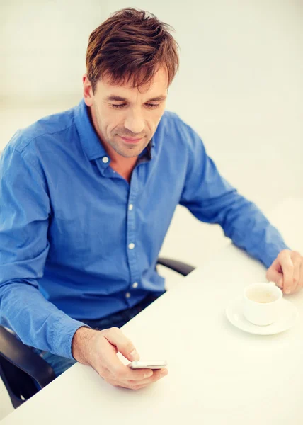 Buisnessman with smartphone and cup of coffee — Stock Photo, Image