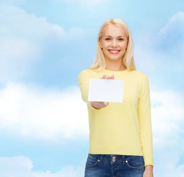 Smiling girl with blank business or name card — Stock Photo, Image