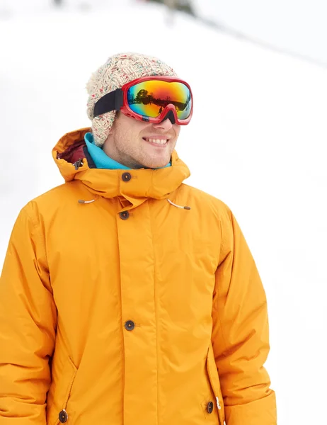 Happy young man in ski goggles outdoors — Stock Photo, Image