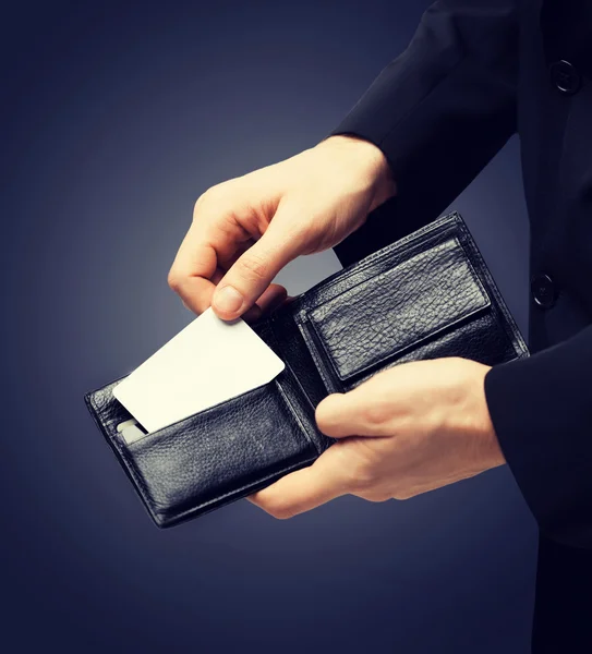 Man in suit holding credit card — Stock Photo, Image