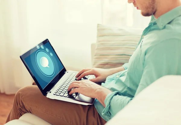 Close up of man working with laptop at home — Stock Photo, Image