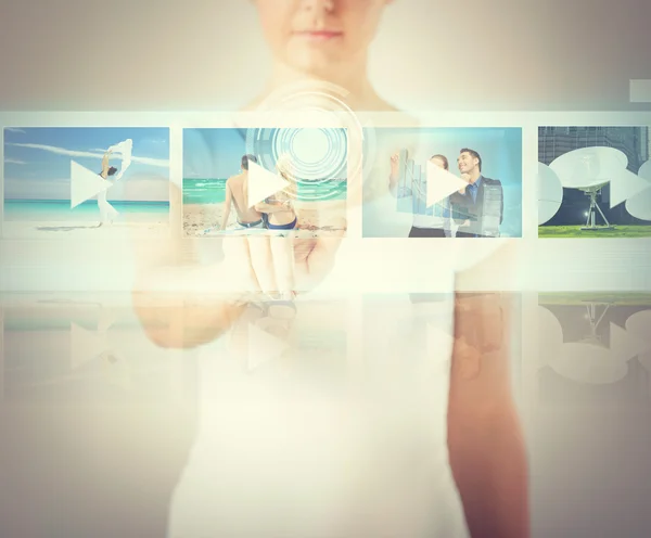 Woman pressing button on virtual screen — Stock Photo, Image