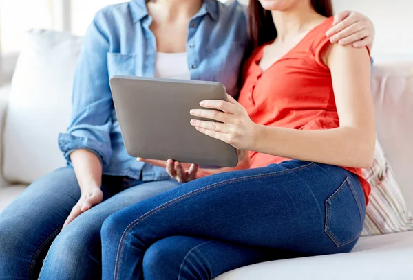 Close up of lesbian couple with tablet pc at home — Stock Photo, Image
