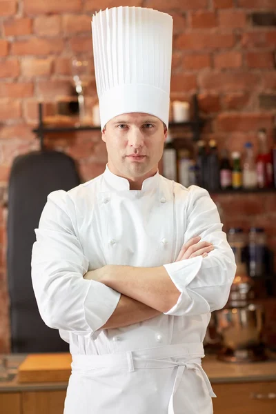 Happy male chef cook in restaurant kitchen Royalty Free Stock Photos