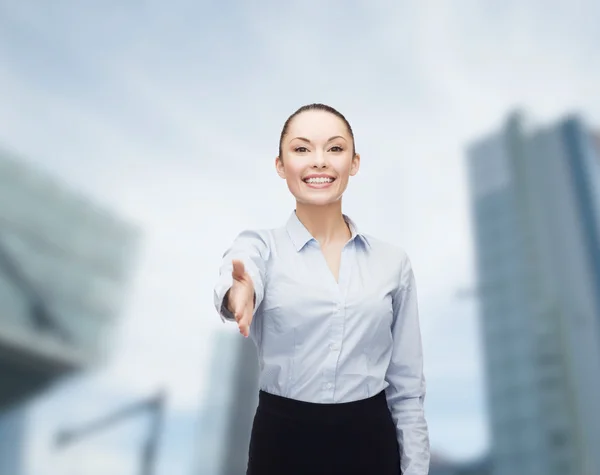 Businesswoman with opened hand ready for handshake — Stock Photo, Image