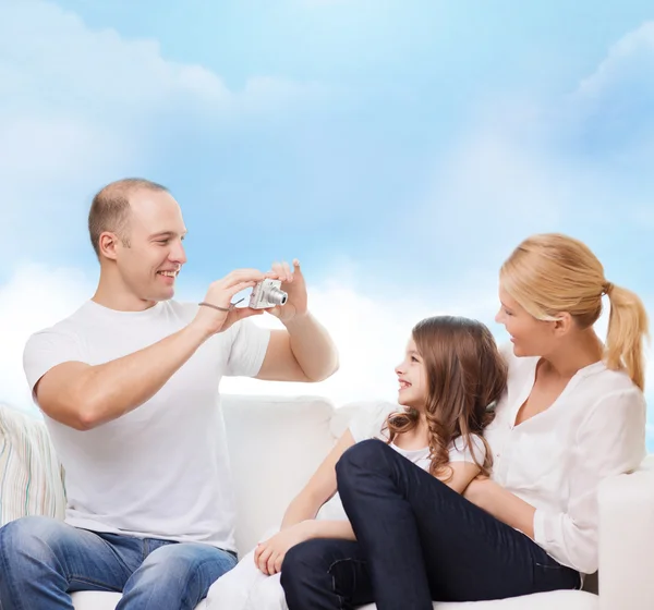 Happy family with camera at home — Stock Photo, Image