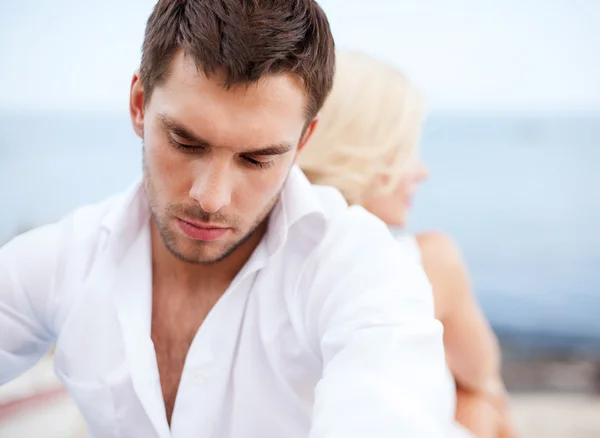 Stressed man with woman outside — Stock Photo, Image