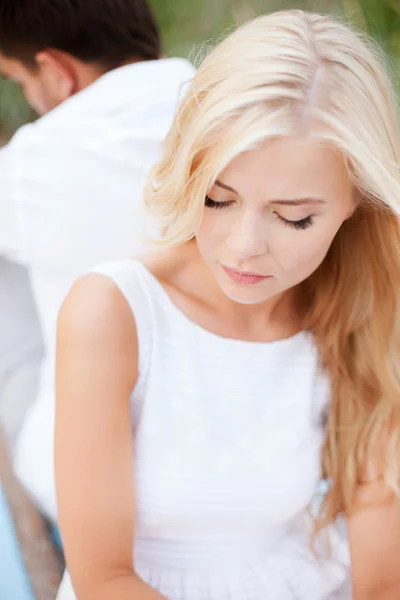 Stressed woman with man outside — Stock Photo, Image