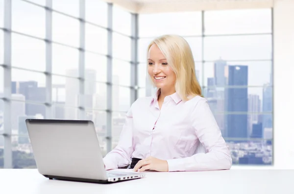 Happy young businesswoman in office — Stock Photo, Image