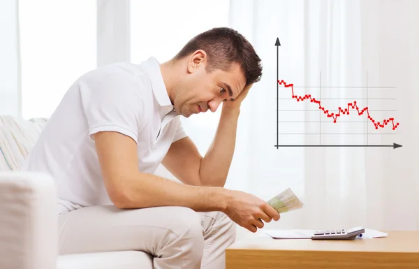 Man with money and calculator — Stock Photo, Image