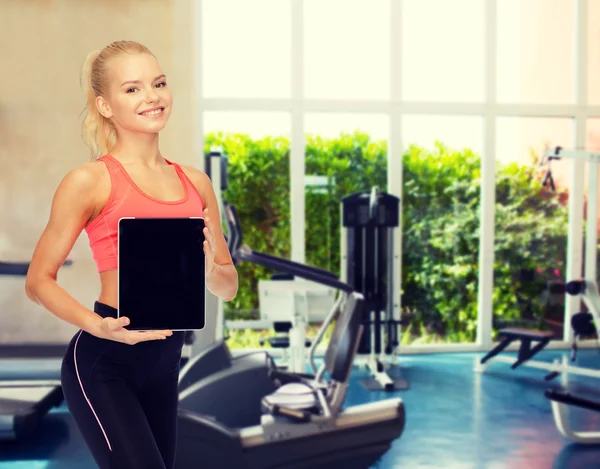 Sporty woman  showing tablet pc — Stock Photo, Image