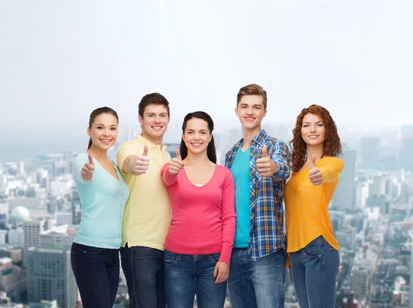 Teenagers showing thumbs up — Stock Photo, Image