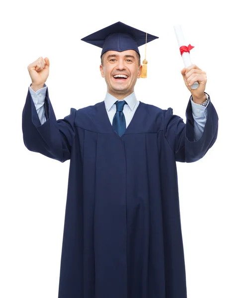 Adult student in mortarboard with diploma — Stock Photo, Image