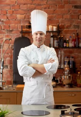 happy male chef cook in restaurant kitchen clipart
