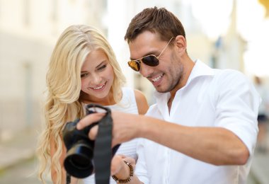 smiling couple with photo camera clipart